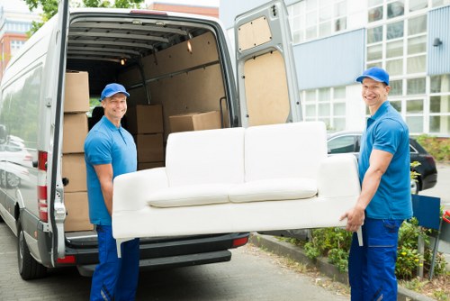 Removal van and moving team in a Maida Hill residential street