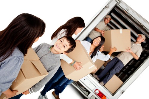 Removal van and movers in a Maida Hill residential street