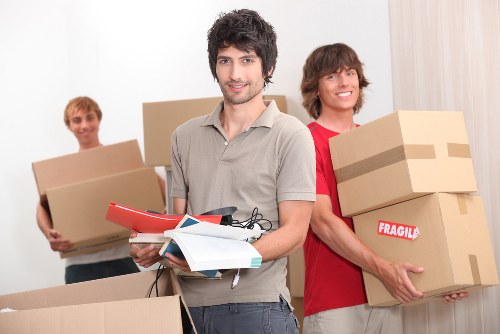 Local movers handling boxes and household items in west London