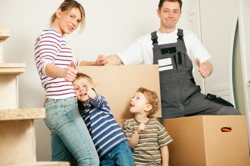 Loading furniture into a van for a move in Maida Hill