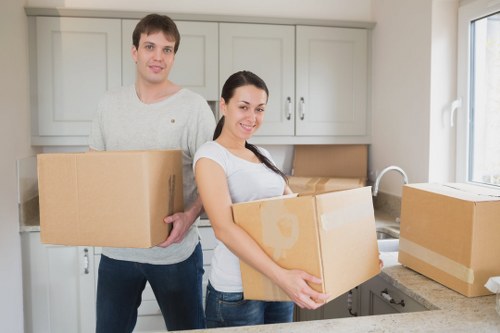 Removal team preparing boxes and furniture in Maida Hill